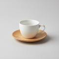 White porcelain coffee cup with wood-tone saucer